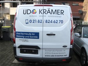 Autobeschriftung mit Folienschrift und Digitaldruck eines Ford Transit Custom der Firma Udo Krämer für in Grevenbroich Kapellen.